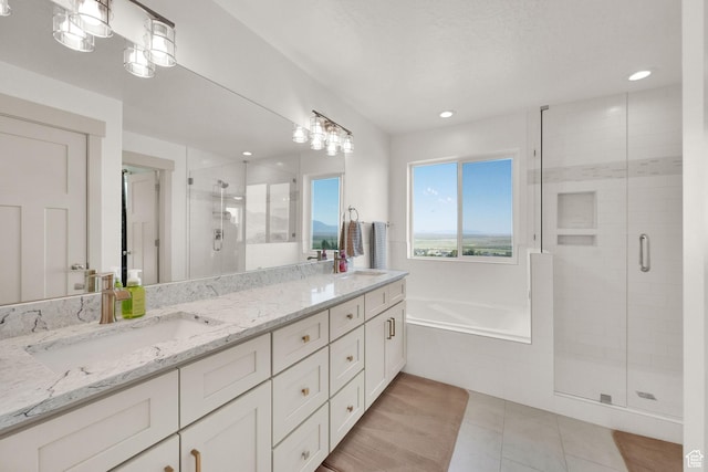 2423 W Cedarline Loop, Stockton, UT 84071 - bathroom with double vanity, a stall shower, a garden tub, tile patterned flooring, and recessed lighting