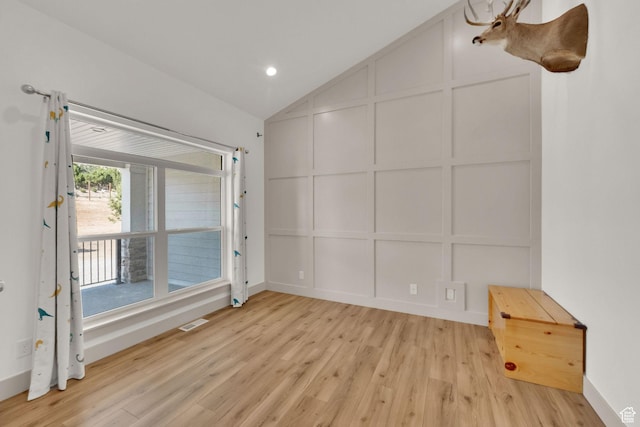 2423 W Cedarline Loop, Stockton, UT 84071 - unfurnished room featuring a decorative wall, light wood-style flooring, vaulted ceiling, and recessed lighting