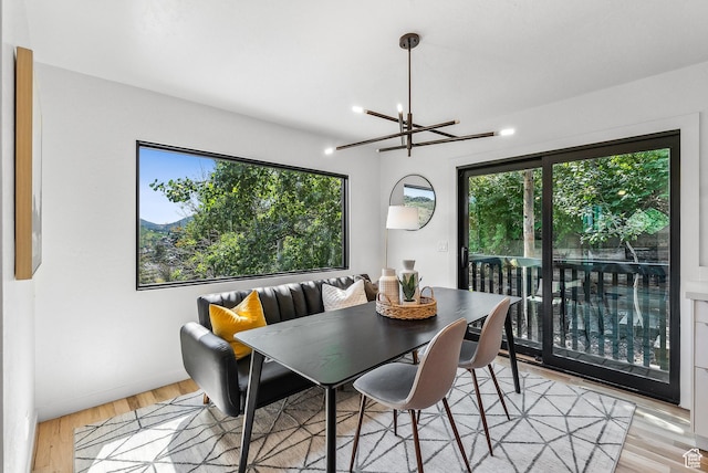 947 Northstar Dr, Park City, UT 84060 - dining area with healthy amount of natural light, a chandelier, and light wood finished floors