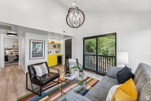 947 Northstar Dr, Park City, UT 84060 - living area with beverage cooler, a chandelier, light wood-style flooring, and a high ceiling