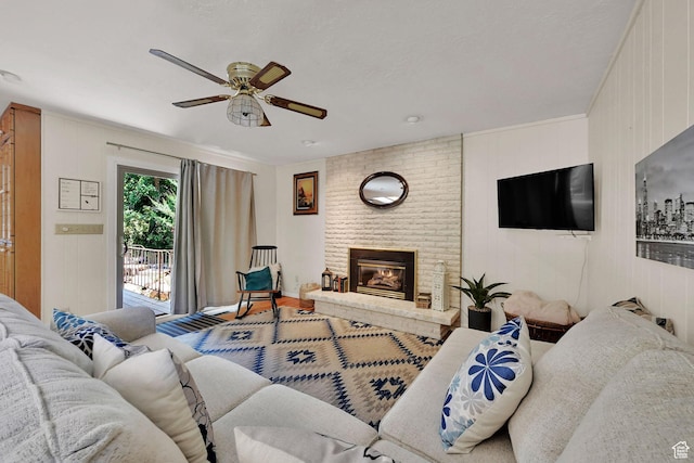 4445 Fillmore Ave, Ogden, UT 84403 - living room featuring ceiling fan, wood finished floors, and a brick fireplace