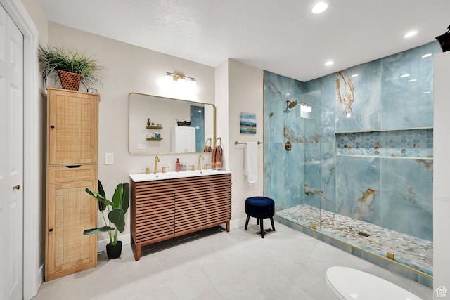 4445 Fillmore Ave, Ogden, UT 84403 - full bathroom featuring a marble finish shower, recessed lighting, double vanity, and tile patterned floors