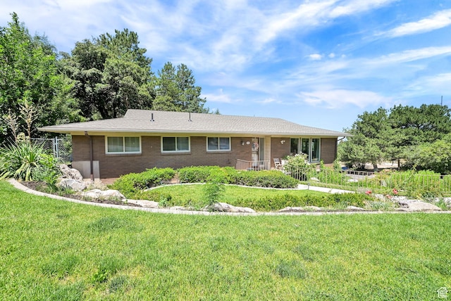 4445 Fillmore Ave, Ogden, UT 84403 - single story home featuring brick siding and a front yard