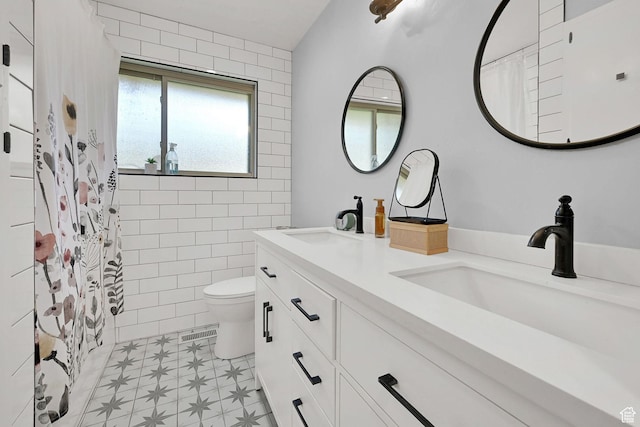 4445 Fillmore Ave, Ogden, UT 84403 - full bathroom featuring double vanity, tile patterned floors, and a shower with curtain