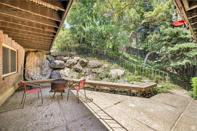4445 Fillmore Ave, Ogden, UT 84403 - fenced backyard with a patio and an outdoor fire pit