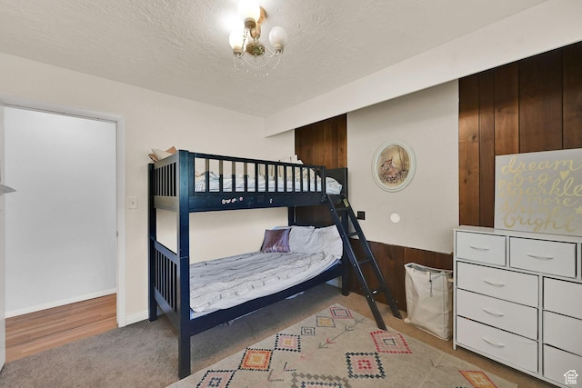 4445 Fillmore Ave, Ogden, UT 84403 - carpeted bedroom featuring a chandelier and a textured ceiling