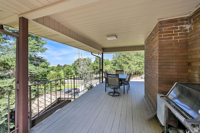 4445 Fillmore Ave, Ogden, UT 84403 - wooden deck featuring outdoor dining space and view of scattered trees