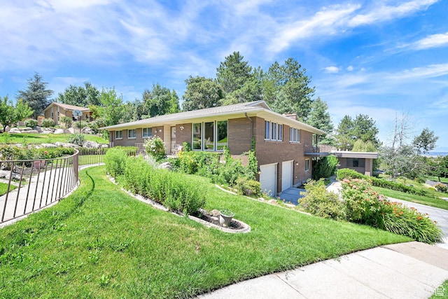 4445 Fillmore Ave, Ogden, UT 84403 - view of front of property with brick siding, an attached garage, and driveway