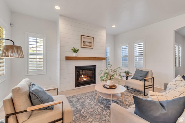 10741 S Topview Rd, South Jordan, UT 84095 - living area featuring plenty of natural light, a large fireplace, wood finished floors, and recessed lighting