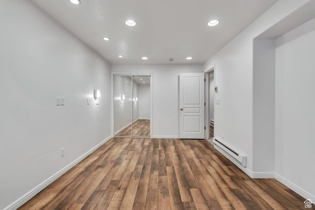 10741 S Topview Rd, South Jordan, UT 84095 - empty room with baseboard heating, recessed lighting, and wood finished floors