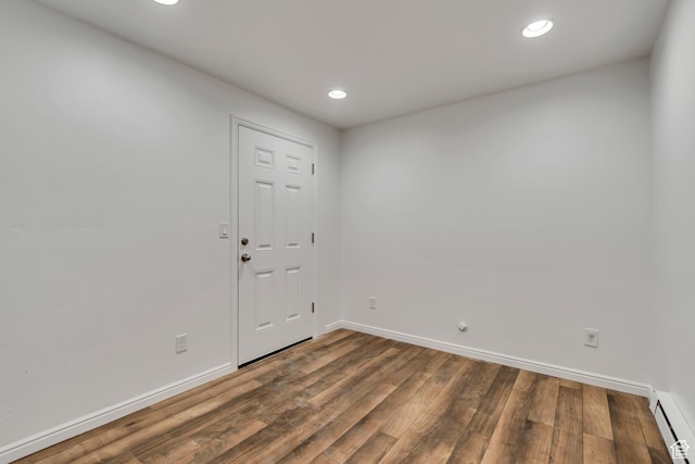 10741 S Topview Rd, South Jordan, UT 84095 - empty room featuring baseboard heating, wood finished floors, and recessed lighting