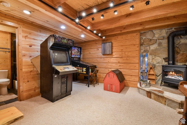 8581 Shingle Mill Dr, Oakley, UT 84055 - office area featuring carpet floors, a wood stove, wood walls, and recessed lighting