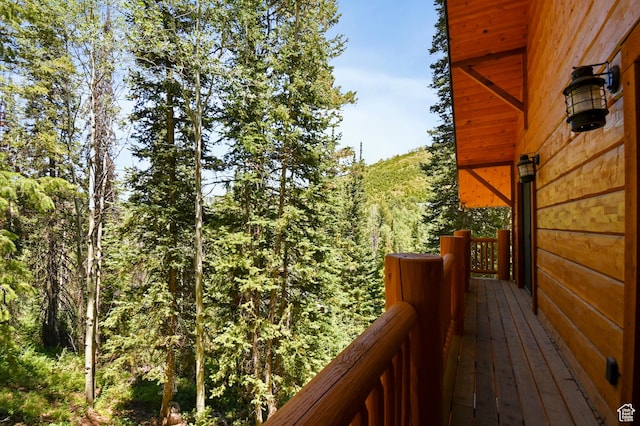 8581 Shingle Mill Dr, Oakley, UT 84055 - wooden terrace with a view of trees