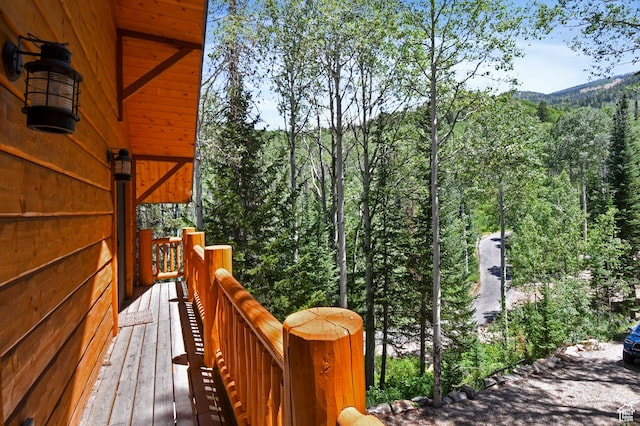 8581 Shingle Mill Dr, Oakley, UT 84055 - wooden deck with a forest view