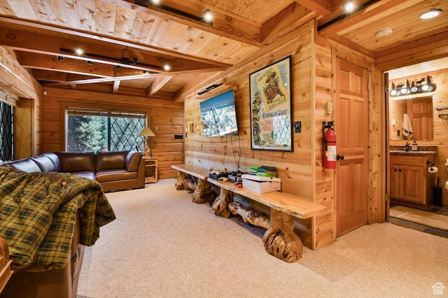 8581 Shingle Mill Dr, Oakley, UT 84055 - carpeted living area with wood walls and a wooden ceiling with exposed beams