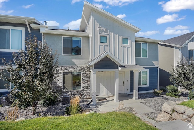 8466 W Cordero Dr S, Magna, UT 84044 - view of front of house with board and batten siding, stone siding, and stucco siding