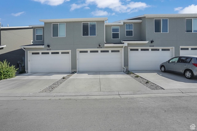 8466 W Cordero Dr S, Magna, UT 84044 - traditional-style house featuring an attached garage, driveway, and stucco siding