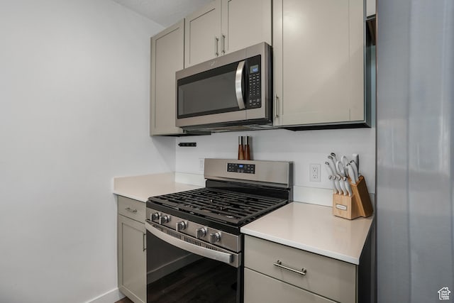 8466 W Cordero Dr S, Magna, UT 84044 - kitchen featuring appliances with stainless steel finishes, gray cabinets, and light countertops