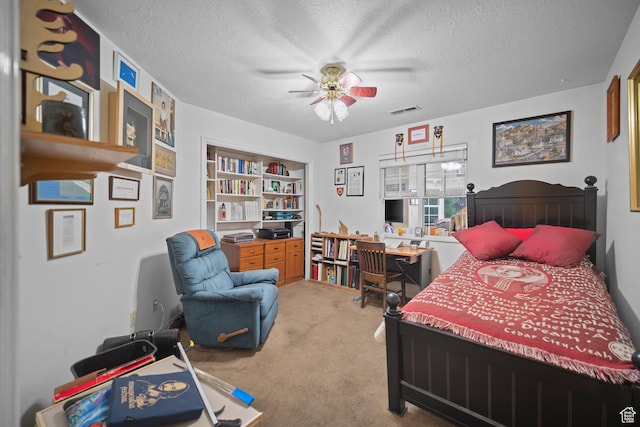 845 N Valley View Dr Unit 917, St George, UT 84770 - carpeted bedroom featuring a textured ceiling, a ceiling fan, and an office area