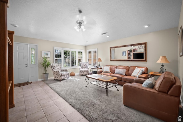 845 N Valley View Dr Unit 917, St George, UT 84770 - carpeted living room with a textured ceiling, tile patterned flooring, and a ceiling fan