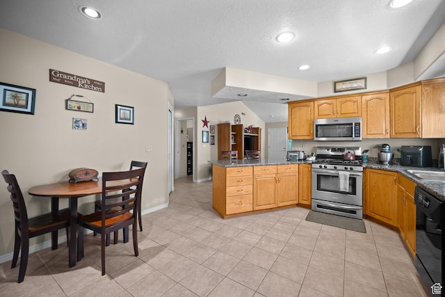 845 N Valley View Dr Unit 917, St George, UT 84770 - kitchen with stainless steel appliances, a peninsula, light tile patterned floors, dark stone counters, and recessed lighting