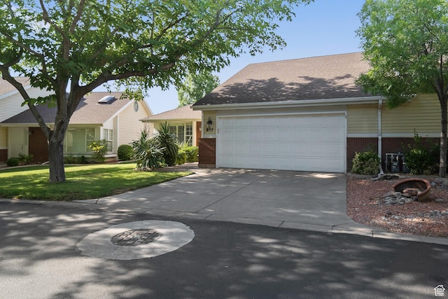 845 N Valley View Dr Unit 917, St George, UT 84770 - view of front of home with concrete driveway, brick siding, an attached garage, and a front lawn