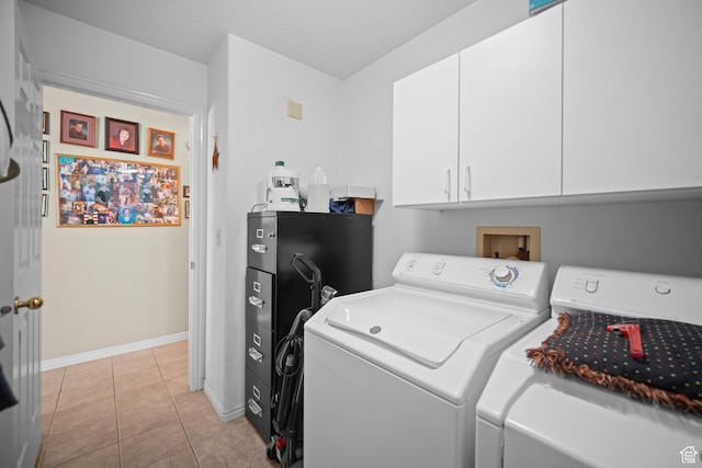 845 N Valley View Dr Unit 917, St George, UT 84770 - washroom featuring washer and dryer, cabinet space, and light tile patterned floors
