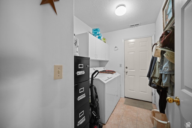 845 N Valley View Dr Unit 917, St George, UT 84770 - laundry area with washing machine and dryer, cabinet space, a textured ceiling, and light tile patterned flooring