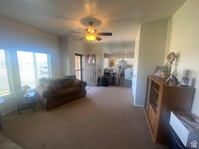 6689 W 7625 S, Myton, UT 84052 - living room featuring light colored carpet and ceiling fan