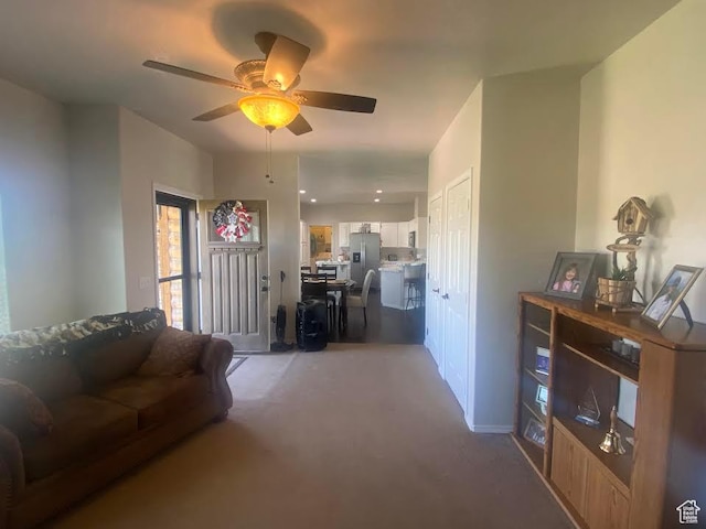 6689 W 7625 S, Myton, UT 84052 - living area with light colored carpet and a ceiling fan