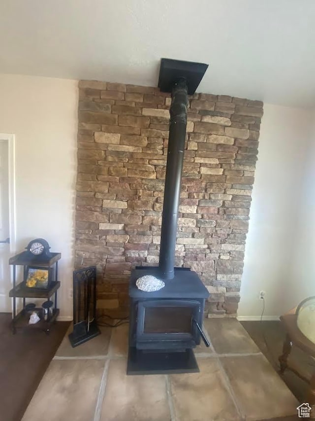 6689 W 7625 S, Myton, UT 84052 - detailed view of a wood stove and baseboards