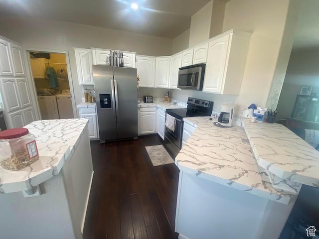 6689 W 7625 S, Myton, UT 84052 - kitchen with stainless steel appliances, washing machine and dryer, a peninsula, white cabinets, and dark wood finished floors