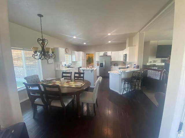 6689 W 7625 S, Myton, UT 84052 - dining area with dark wood finished floors and a chandelier