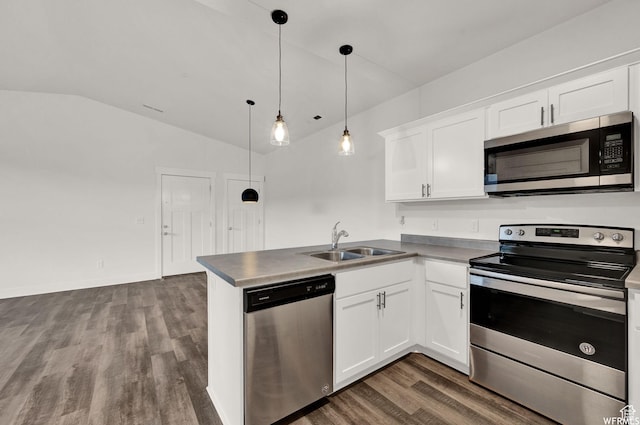 14708 S Astin Ln Unit 302, Herriman, UT 84096 - kitchen featuring appliances with stainless steel finishes, dark wood-style flooring, vaulted ceiling, a peninsula, and white cabinets