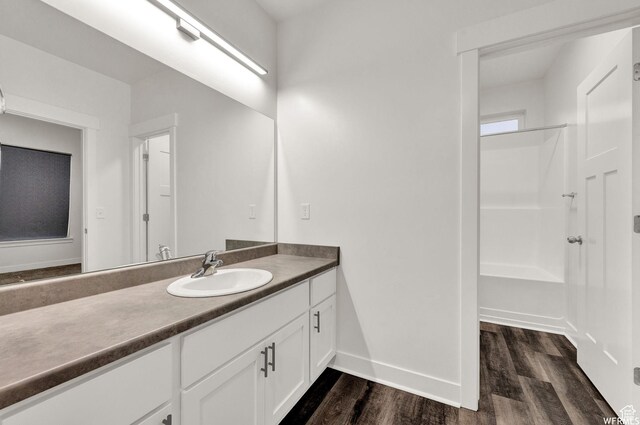 14708 S Astin Ln Unit 302, Herriman, UT 84096 - bathroom featuring wood finished floors and vanity