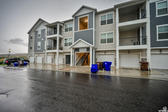 14708 S Astin Ln Unit 302, Herriman, UT 84096 - view of building exterior featuring an attached garage