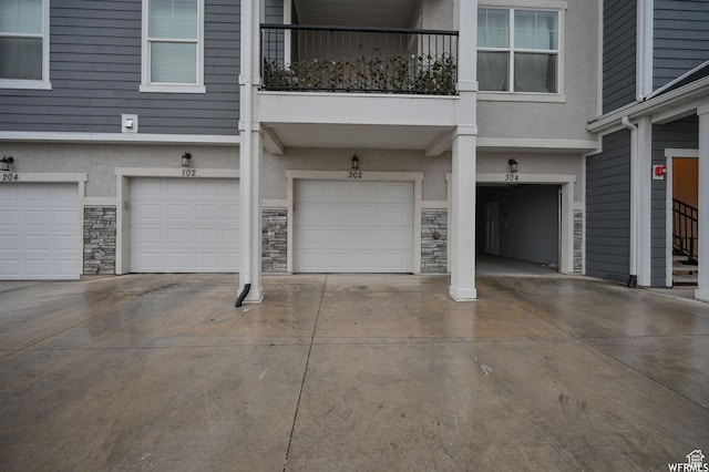 14708 S Astin Ln Unit 302, Herriman, UT 84096 - garage with driveway