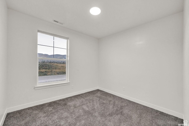14708 S Astin Ln Unit 302, Herriman, UT 84096 - spare room with dark carpet and baseboards