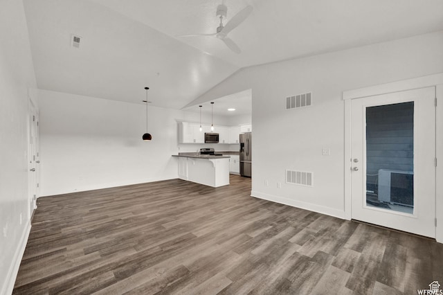 14708 S Astin Ln Unit 302, Herriman, UT 84096 - unfurnished living room with vaulted ceiling, dark wood finished floors, and ceiling fan