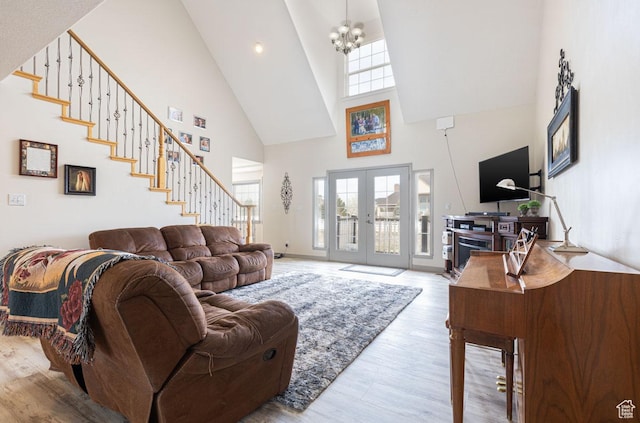 1444 N 3775 W, Cedar City, UT 84721 - living room with high vaulted ceiling, wood finished floors, french doors, stairway, and a chandelier
