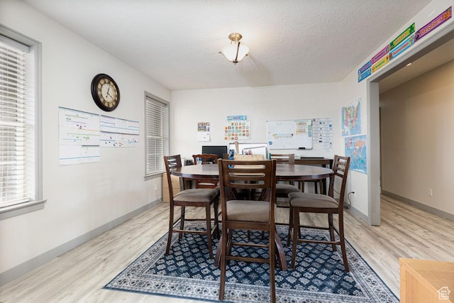 1444 N 3775 W, Cedar City, UT 84721 - dining room with light wood finished floors, a textured ceiling, and plenty of natural light