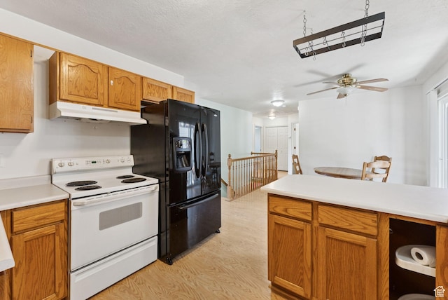 2970 W Shadow Park Dr, West Valley City, UT 84119 - kitchen with white range with electric cooktop, under cabinet range hood, black refrigerator with ice dispenser, light wood-type flooring, and light countertops