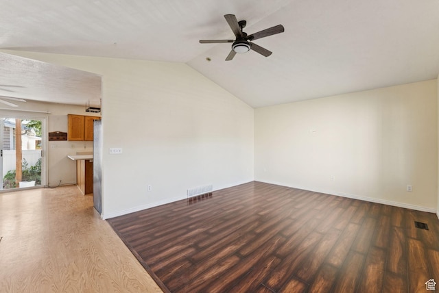 2970 W Shadow Park Dr, West Valley City, UT 84119 - unfurnished living room with ceiling fan, wood finished floors, and vaulted ceiling