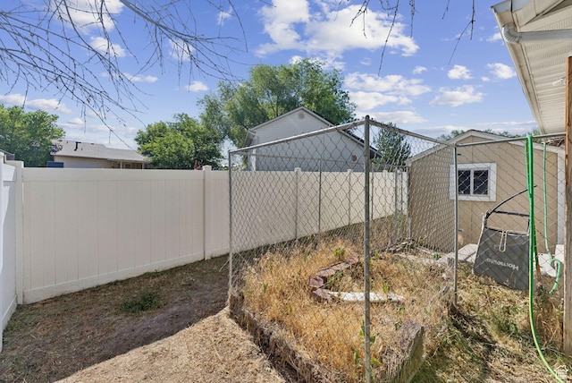 2970 W Shadow Park Dr, West Valley City, UT 84119 - fenced backyard with an outdoor structure