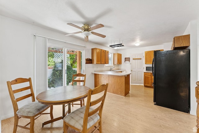 2970 W Shadow Park Dr, West Valley City, UT 84119 - dining space featuring a ceiling fan and light wood-style flooring