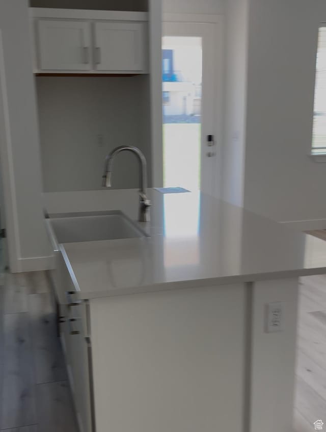6178 S Kelly Ln, St George, UT 84790 - kitchen featuring a center island with sink, white cabinetry, and light countertops