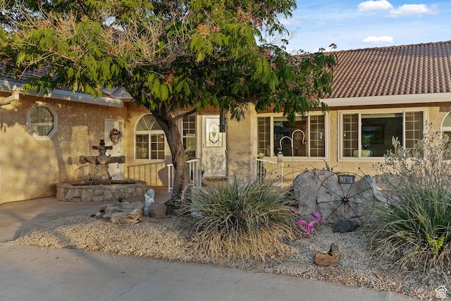 763 W 100 N, Hurricane, UT 84737 - view of front of home with stucco siding and a tiled roof