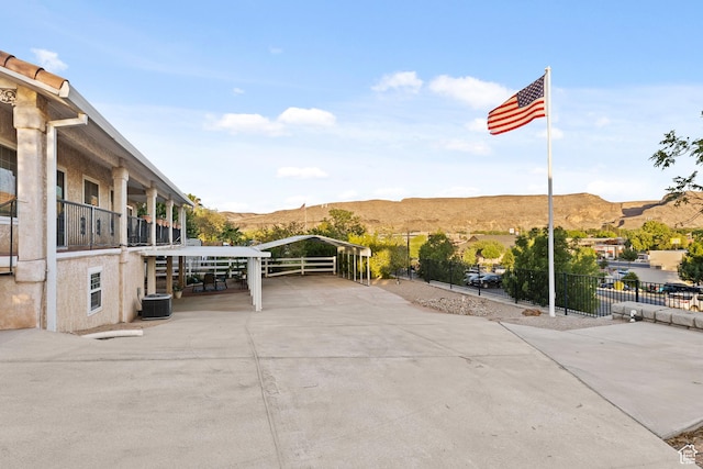 763 W 100 N, Hurricane, UT 84737 - view of patio featuring a mountain view, a carport, and driveway
