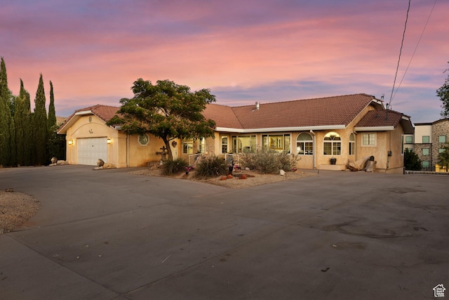 763 W 100 N, Hurricane, UT 84737 - mediterranean / spanish home with a tile roof, driveway, stucco siding, and a garage