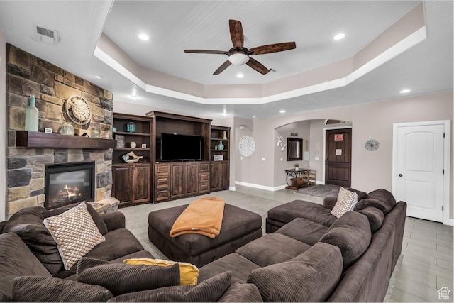3334 W 2700 S, Hurricane, UT 84737 - living area with arched walkways, ceiling fan, a tray ceiling, recessed lighting, and a fireplace